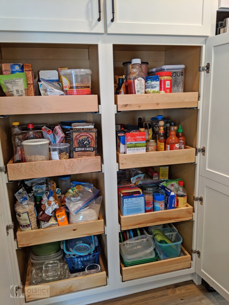 Custom pantry design with roll out shelves