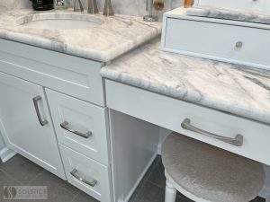 vanity with marble countertop