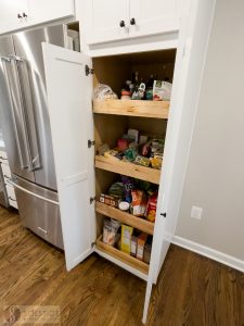 white kitchen cabinets with pantry storage